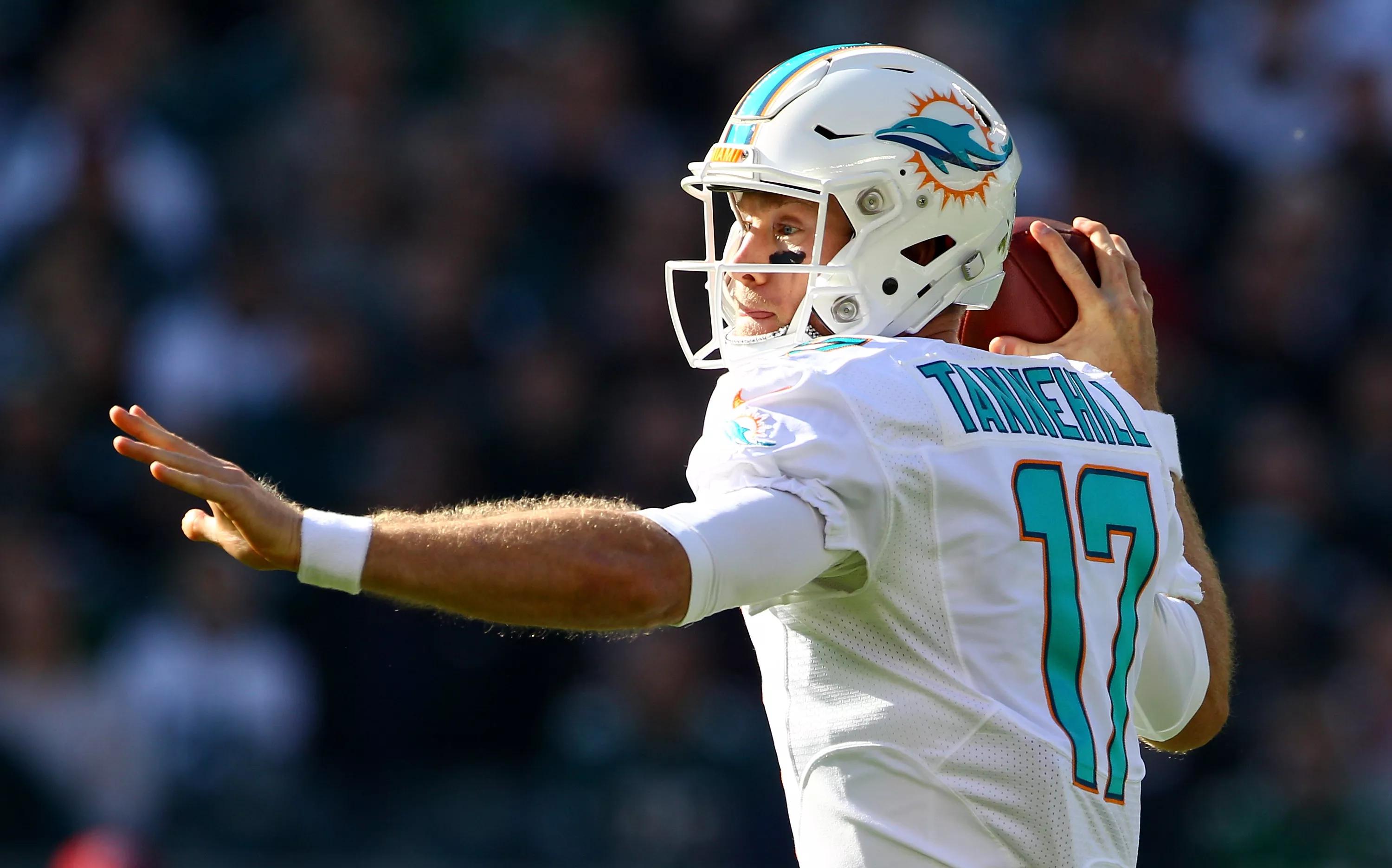 Quarterback Ryan Tannehill winds up for a pass with his front arm extend and his throwing arm ready for release