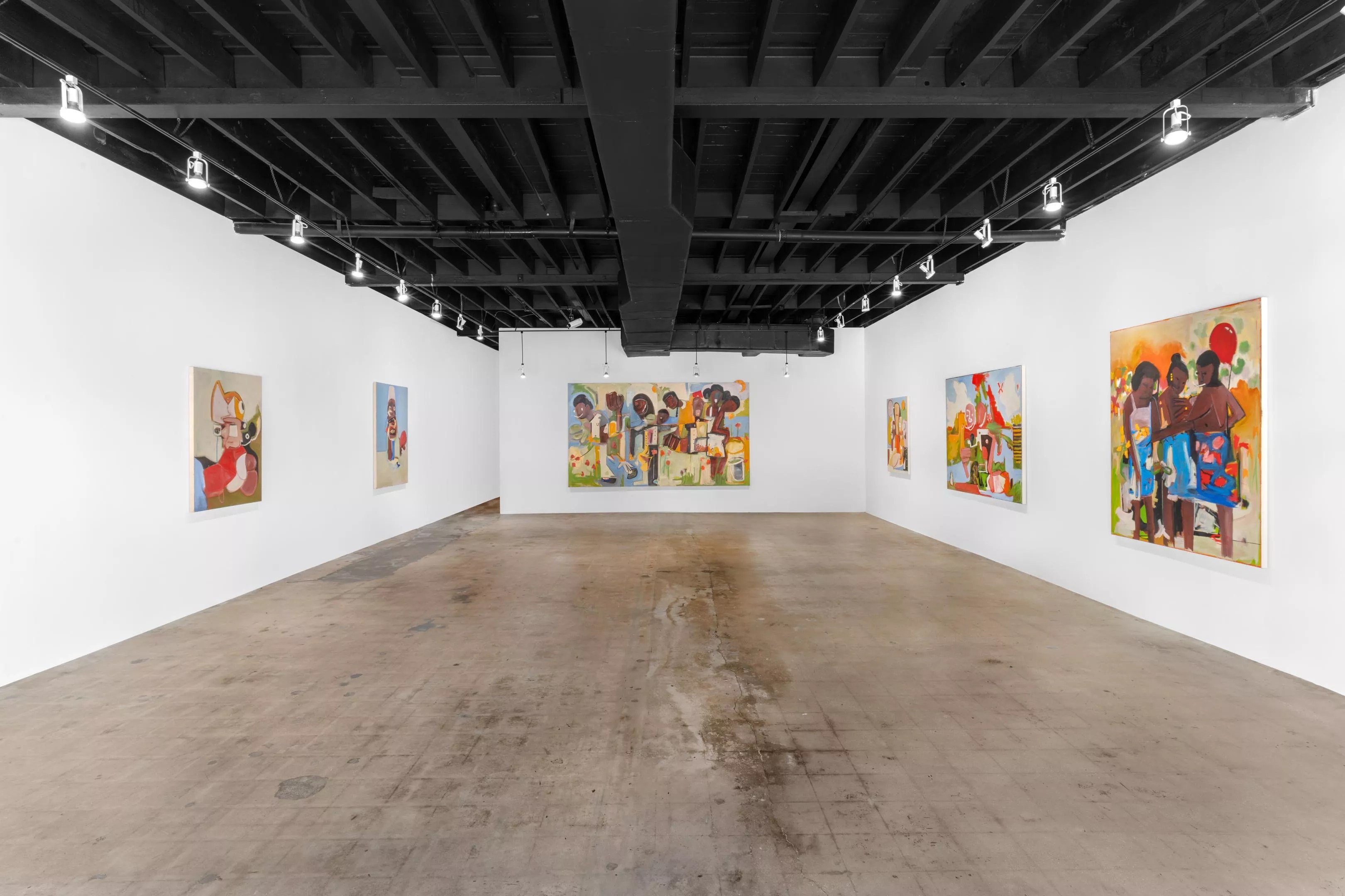 Gallery will paintings hanging on the wall