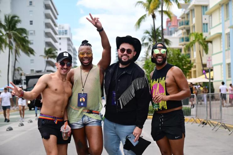Four men standing in the middle of the street