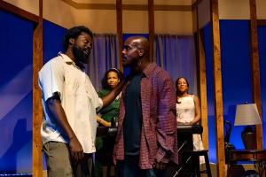 Jean Hyppolite, Carey Brianna Hart, Charles Reuben, and Dina Lewis on stage in Bourbon at the Border