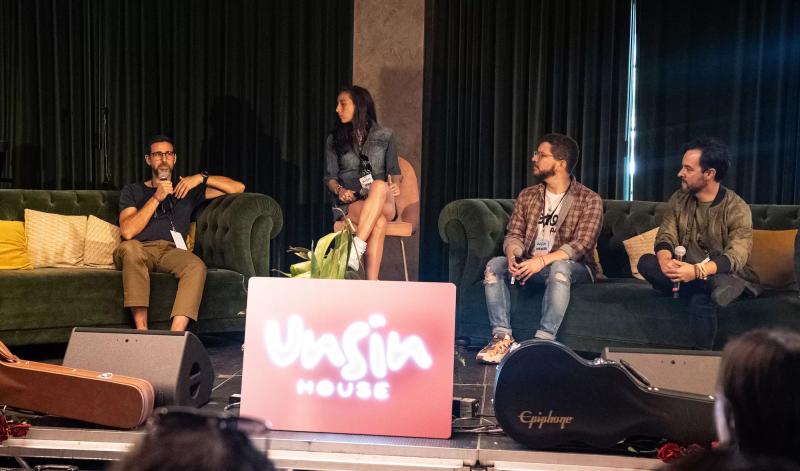 A group of panelists on stage