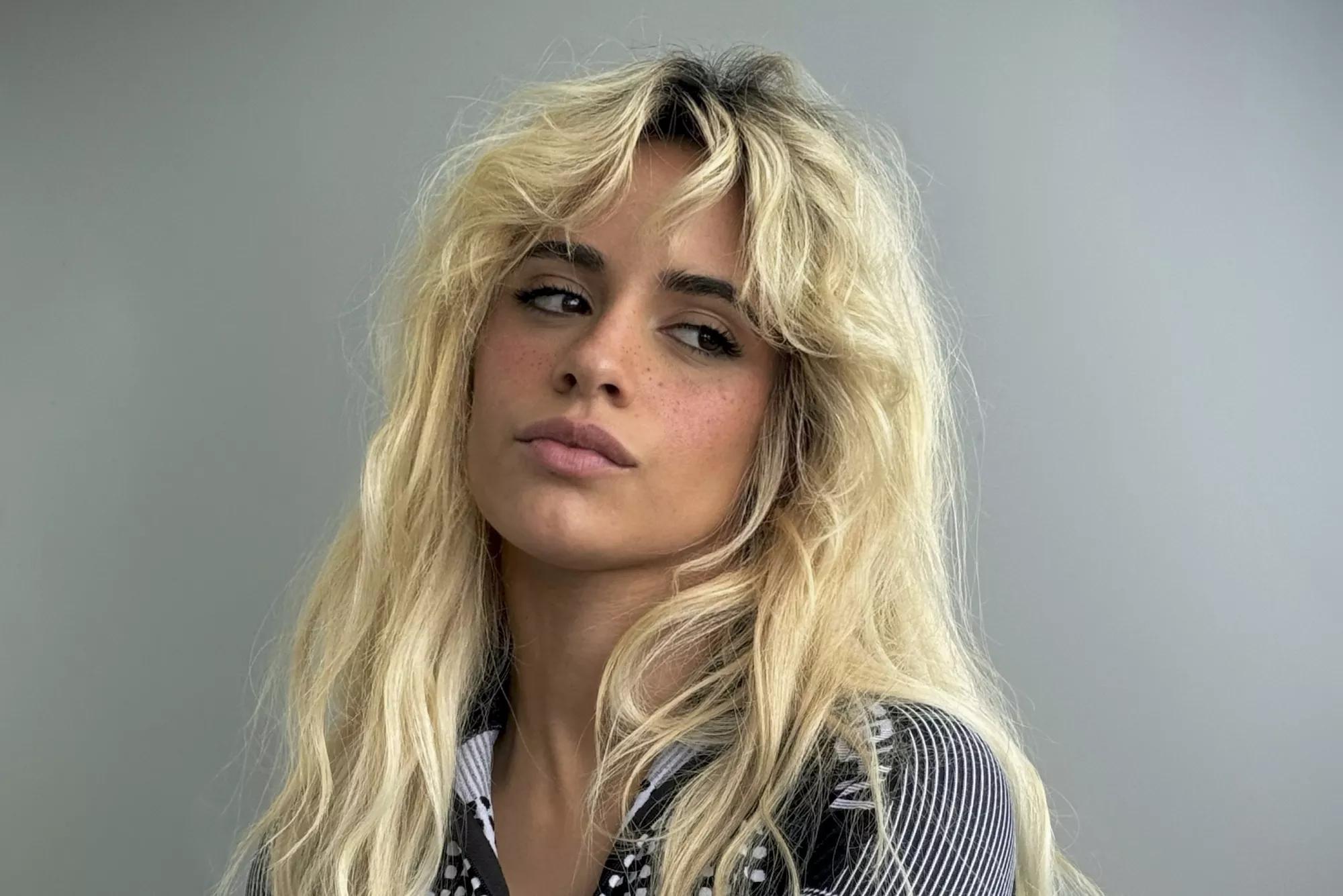 Portrait of Camila Cabello against a gray background