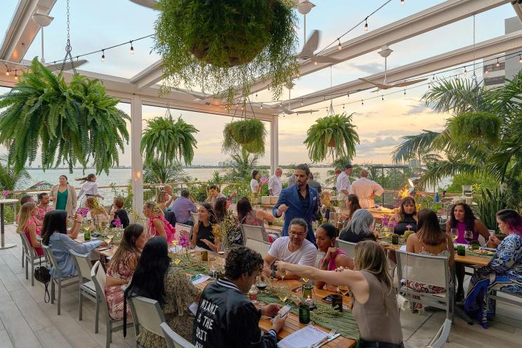 Group of people at the outdoor dining area at Amara at Paraiso