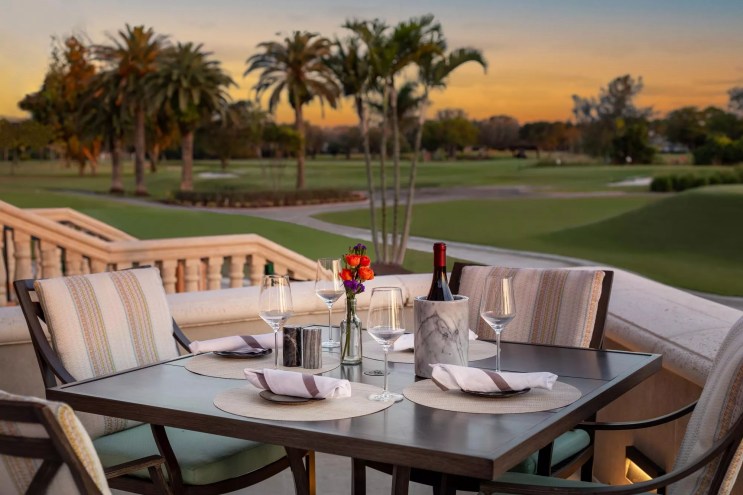Dining table outdoors overlooking golf course