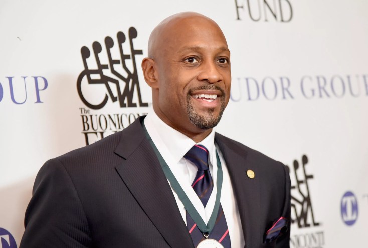 Retired Miami Heat star Alonzo Mourning smiles at a photo walk for a charity dinner in New York City.