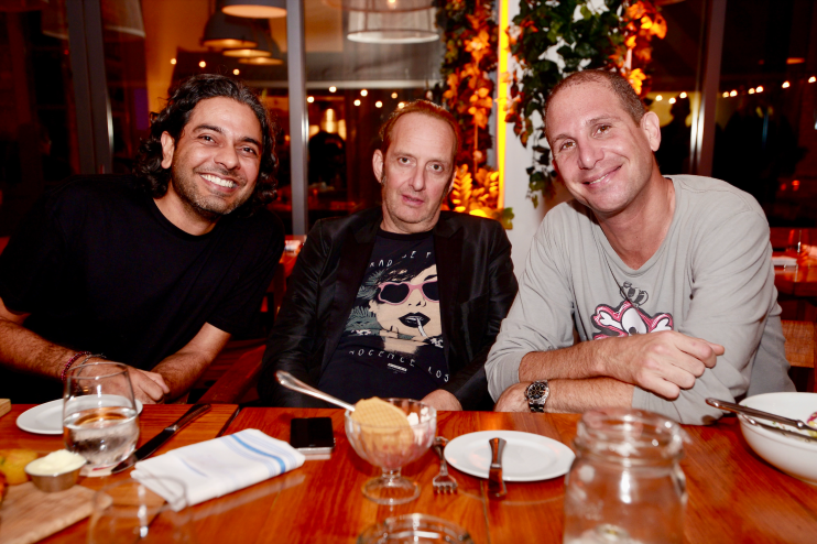 Three men posing for a photo