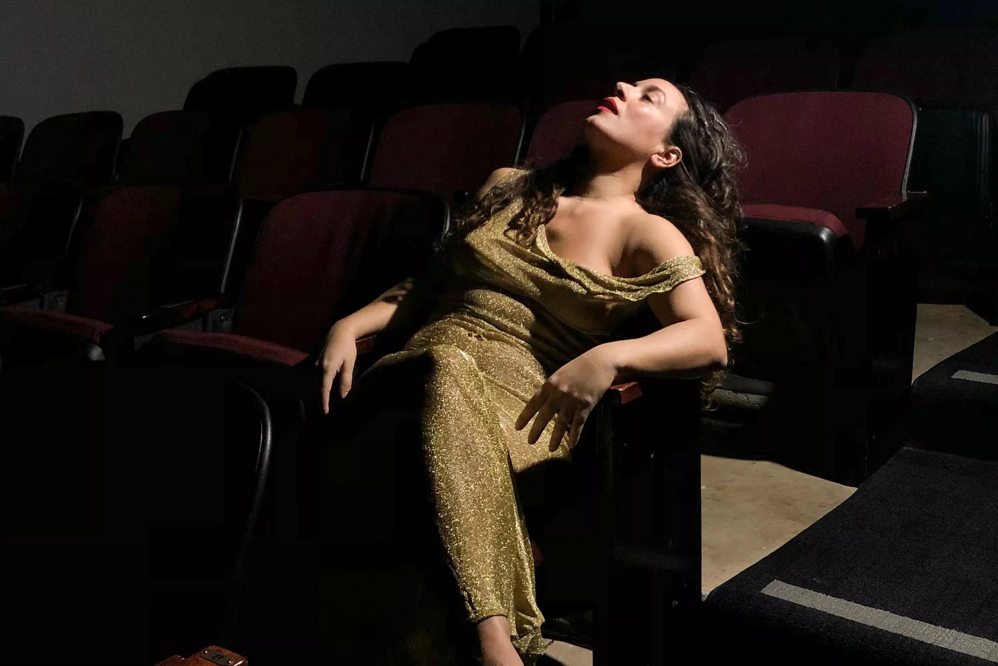 Rosie Herrera slum in a theater seat
