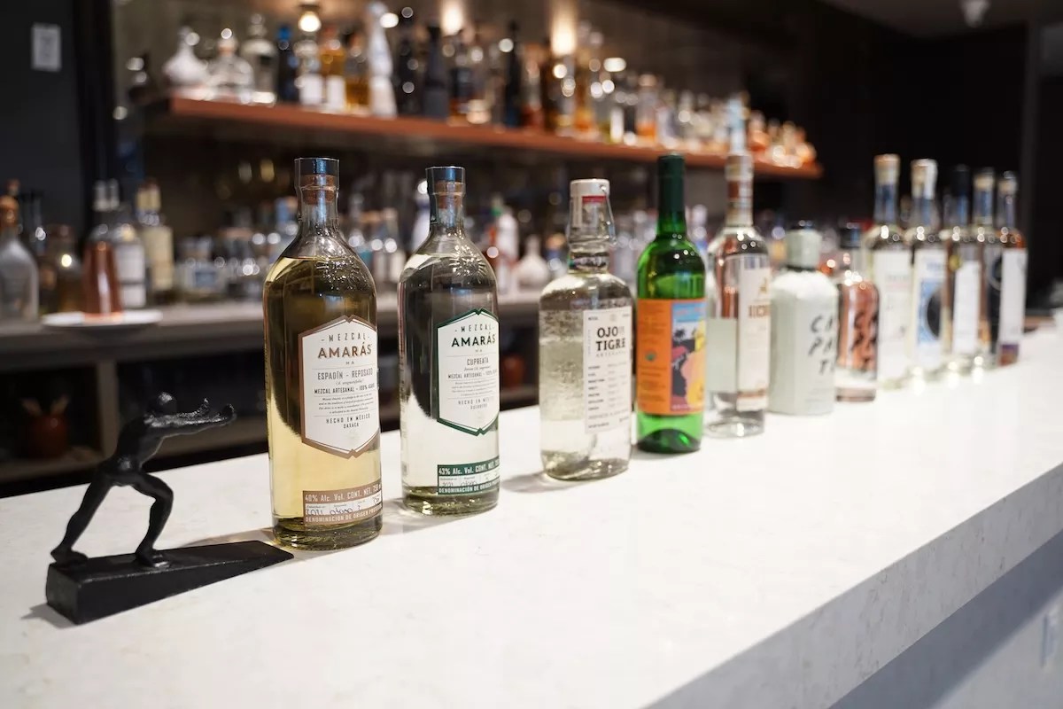 bottles of mezcal on a table