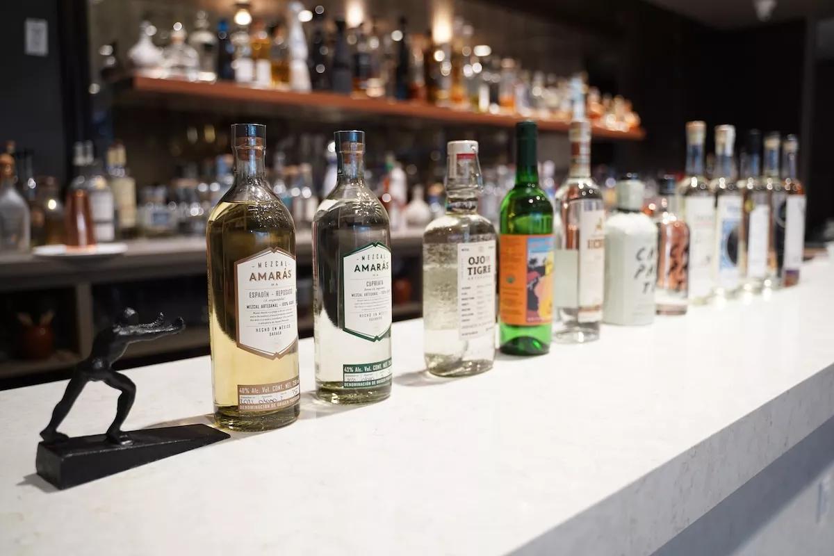 bottles of mezcal on a table