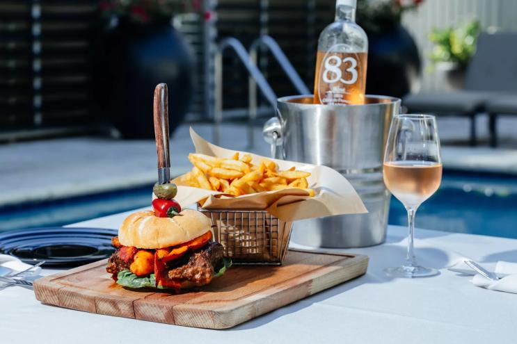 a loaded burger on a table