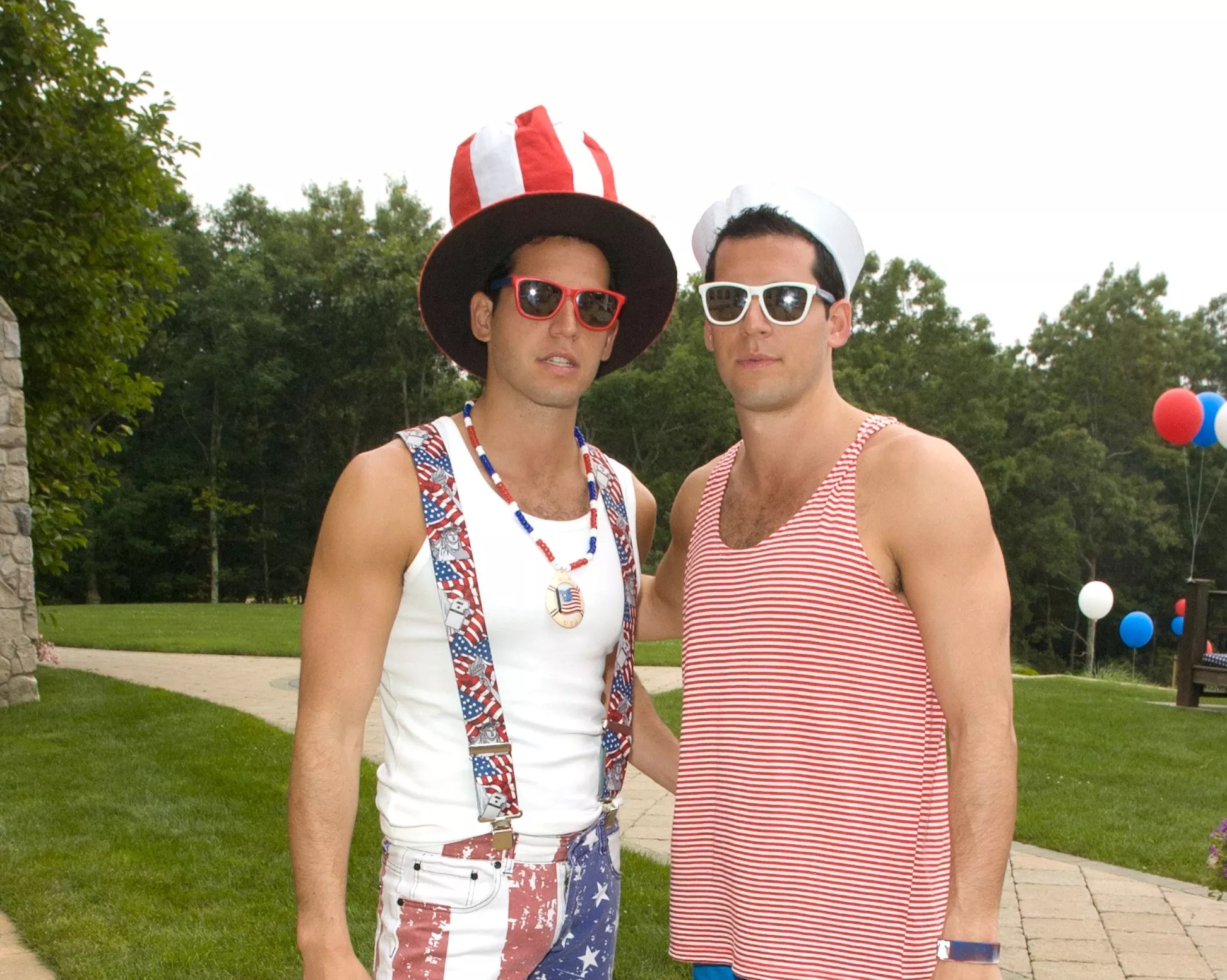 The Alexander twins dressed in patriotic costumes outside a large mansion
