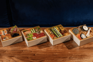 sushi boxes on wood table