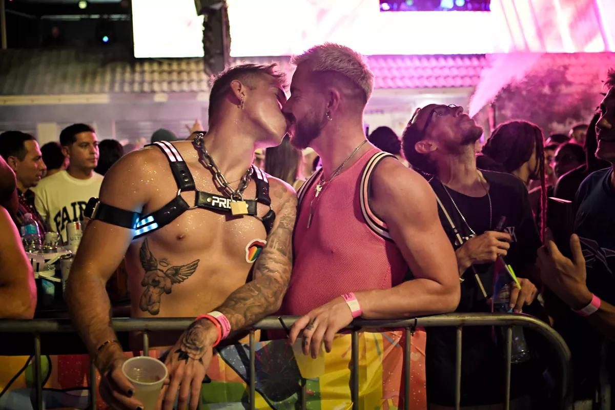 Two men kissing at the Stonewall Pride Parade