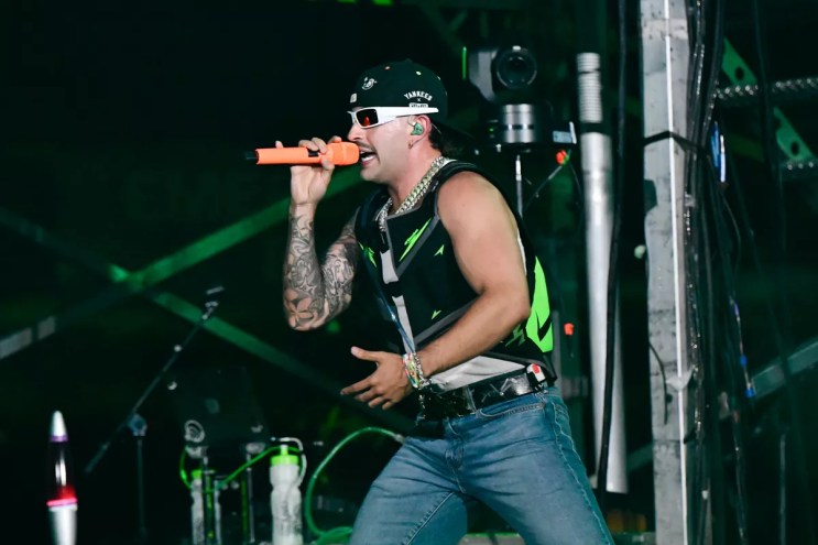 Feid performing on stage at Hard Rock Stadium