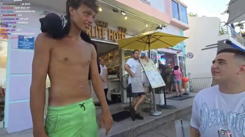 17-year-old Troy Coleman, shirtless, wearing bright green shorts