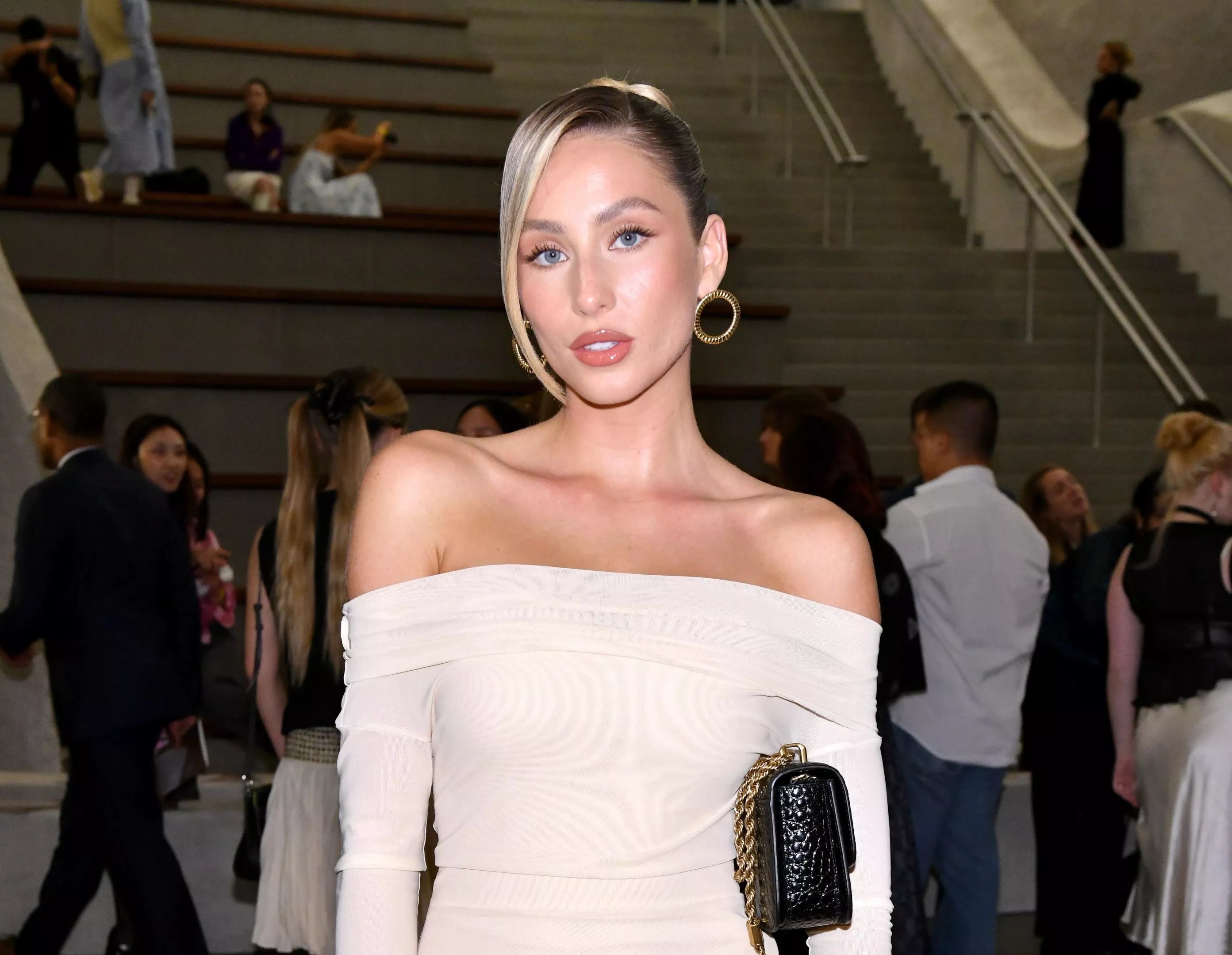Alix Earle in a long white, shoulderless dress