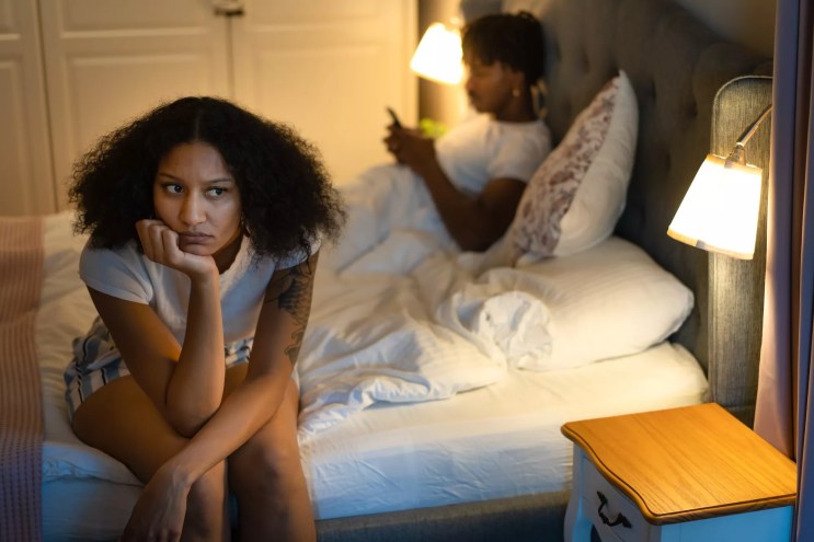 Frustrated couple in bed