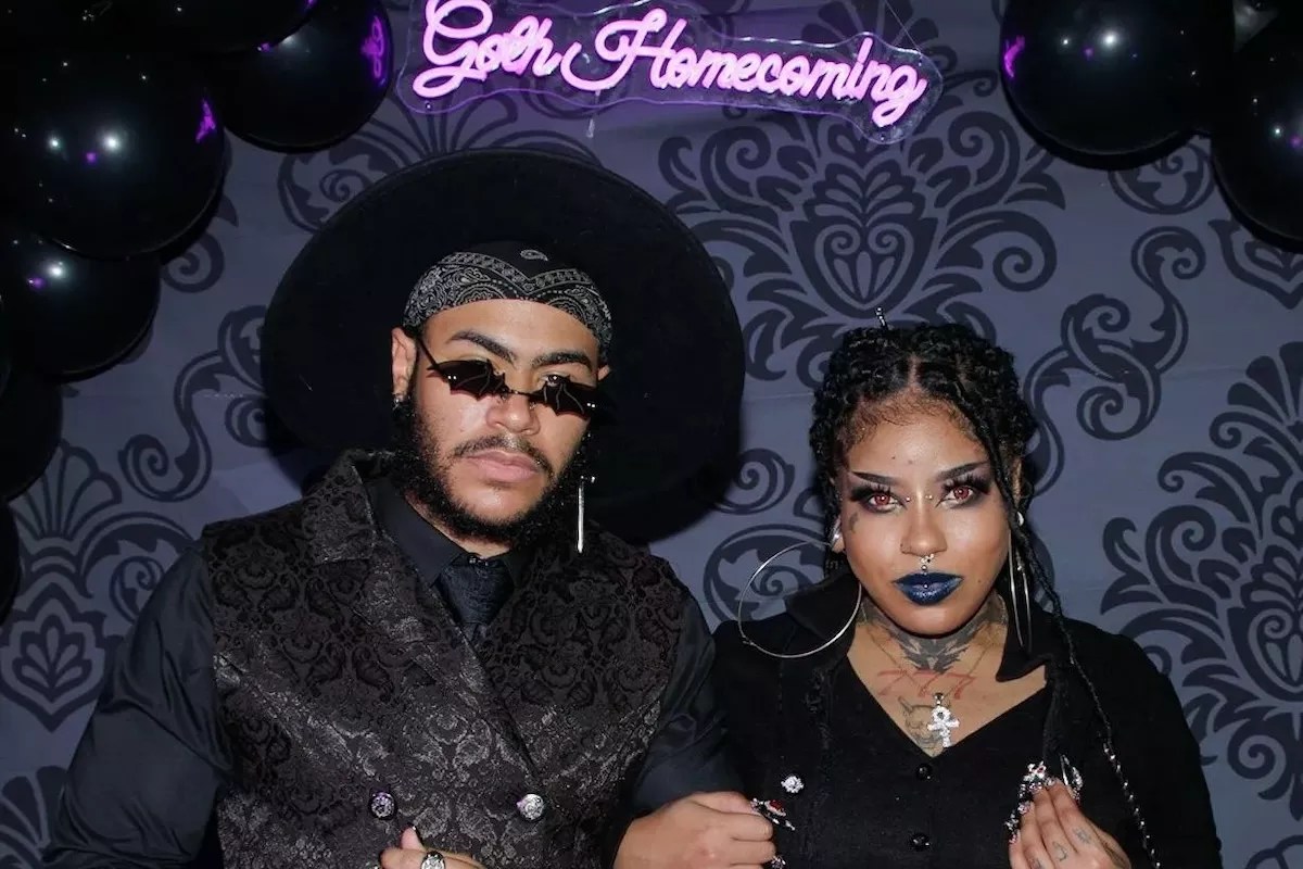 A couple dresses in all black at Goth Homecoming