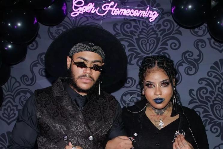 A couple dresses in all black at Goth Homecoming