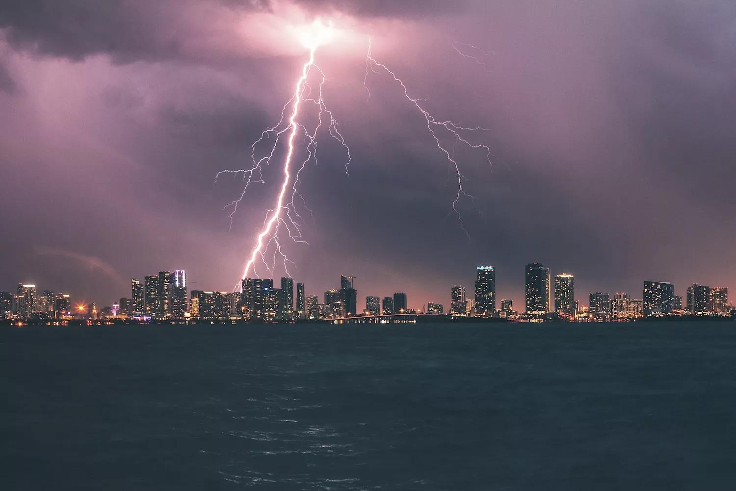 A stunning lightning strike illuminates the Miami skyline at night
