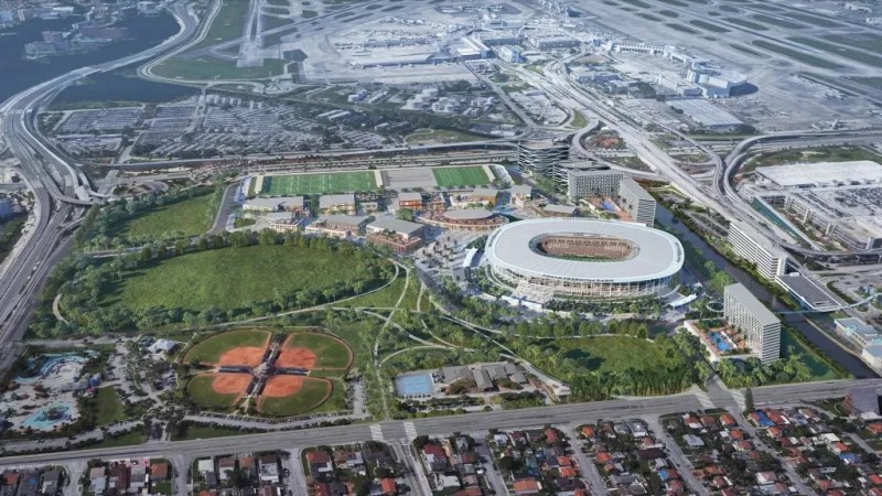 Aerial view of Miami's Nu Stadium surrounded by greenery, highways, and the airport