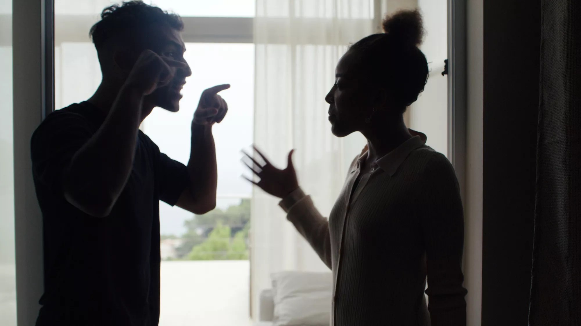 Silhouette of a couple arguing