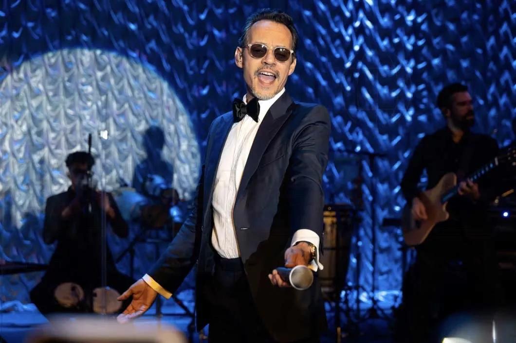 Photo of Mark Anthony wearing a smoking suit