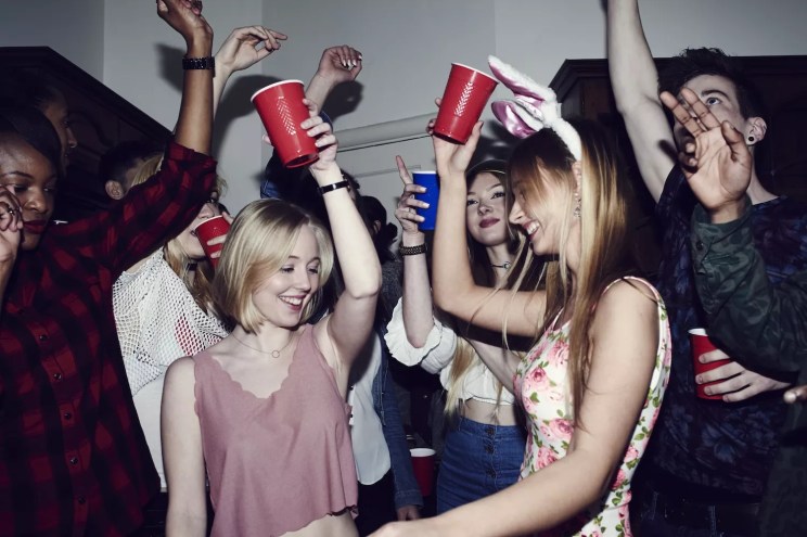 stock photo of group of friends with red Solo cups at a party