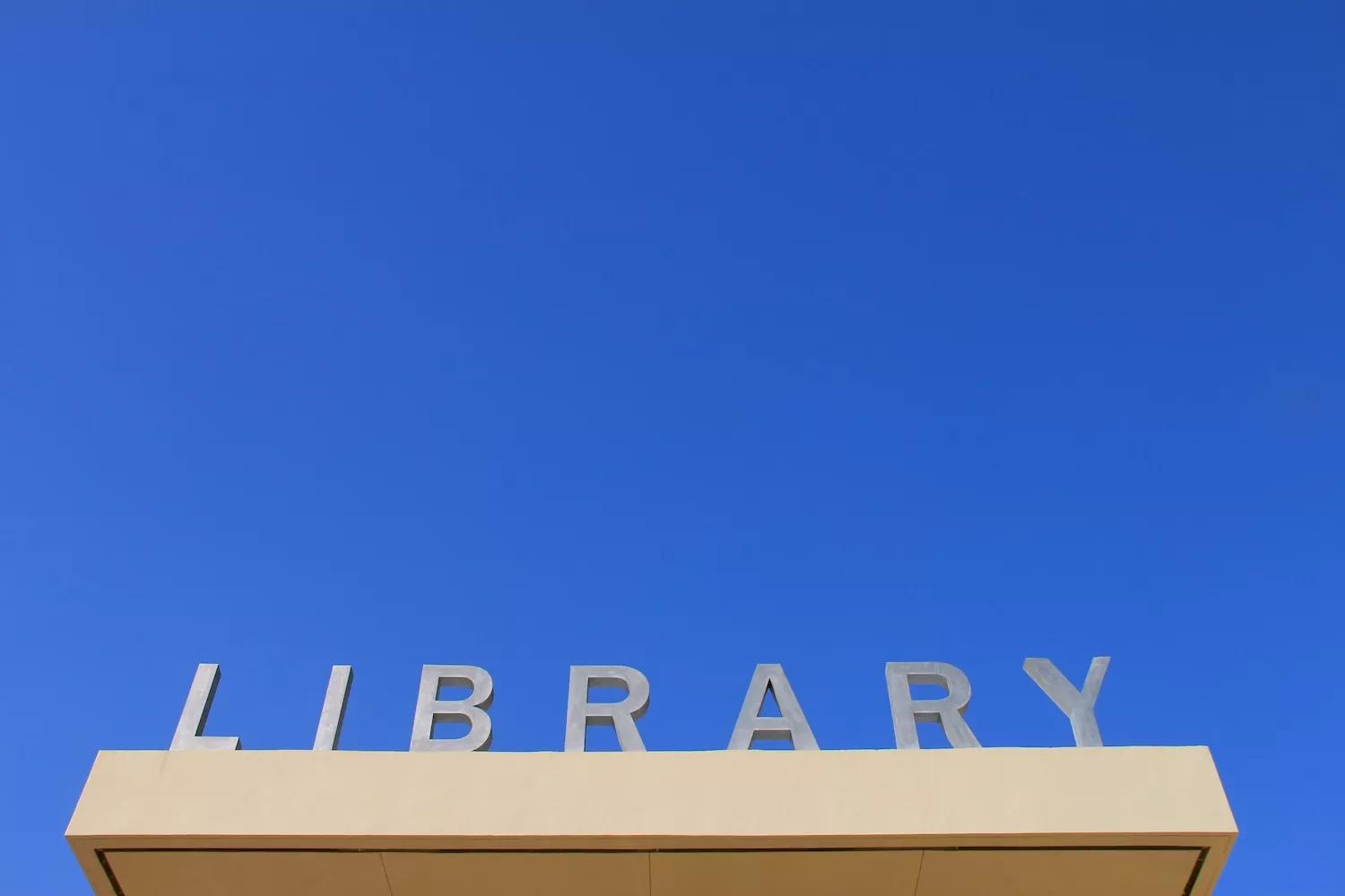 graphically interesting photo of the LIBRARY  sign above the entrance to the Miami Beach Regional Library at 227 22nd St.