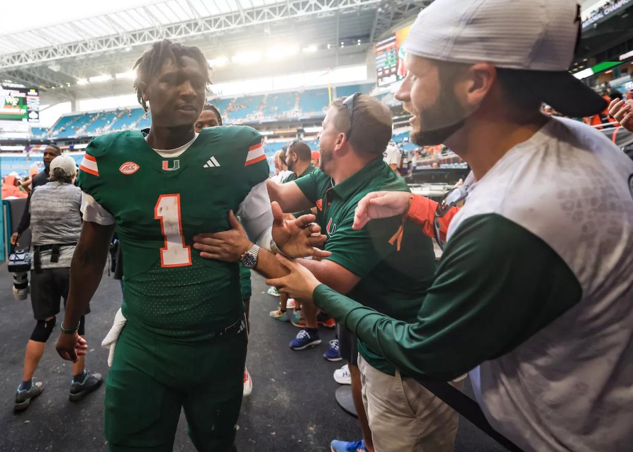 MIAMI GARDENS, FLORIDA - NOVEMBER 02: Cam Ward #1 of the Miami Hurricanes high fives fans following a win over the Duke Blue Devils at Hard Rock Stadium on November 02, 2024 in Miami Gardens, Florida.
