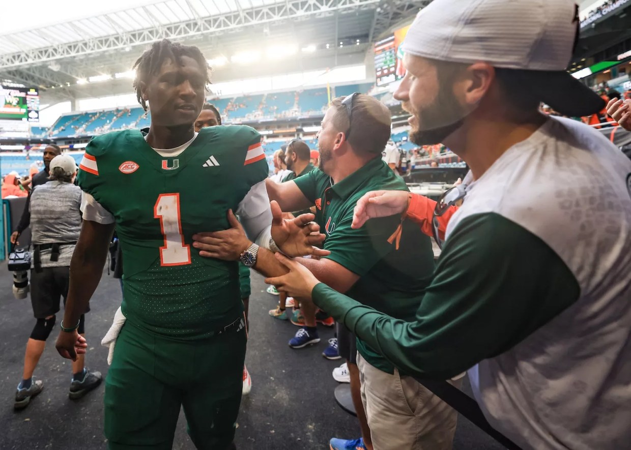 MIAMI GARDENS, FLORIDA - NOVEMBER 02: Cam Ward #1 of the Miami Hurricanes high fives fans following a win over the Duke Blue Devils at Hard Rock Stadium on November 02, 2024 in Miami Gardens, Florida.