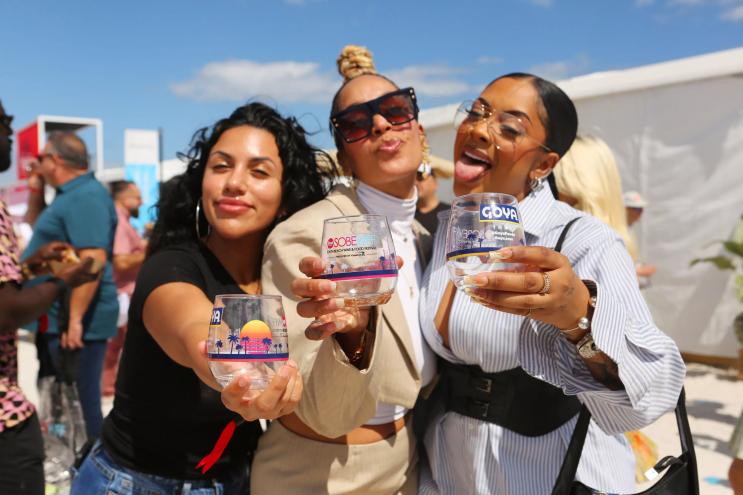 women holding glasses