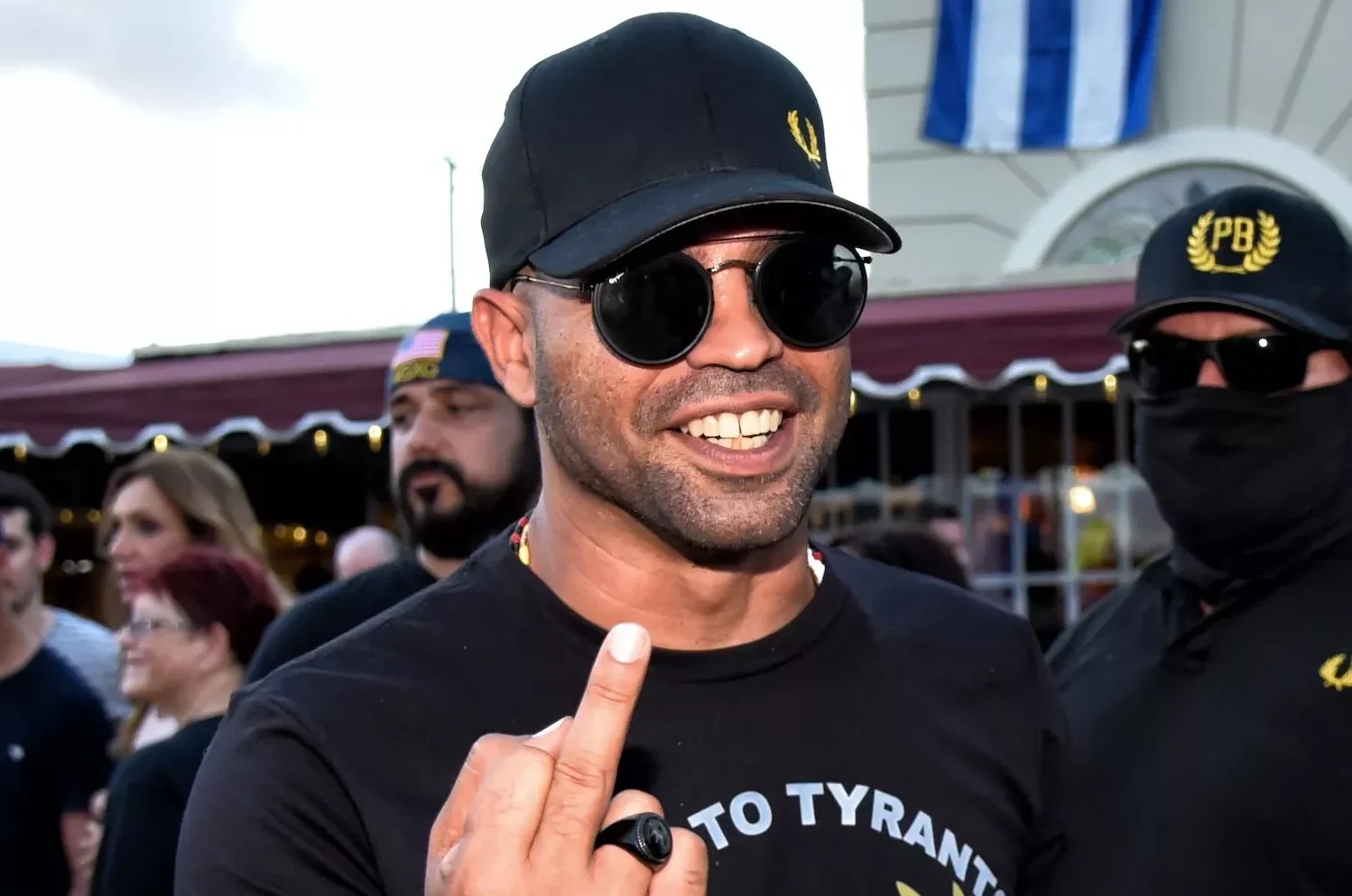 Photo of then-Proud Boys leader Enrique Tarrio flipping his middle finger at the photographer.