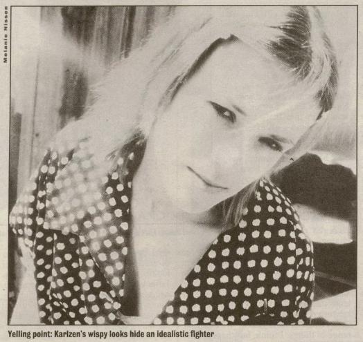 black and white close-up portrait of a woman, printed in a newspaper