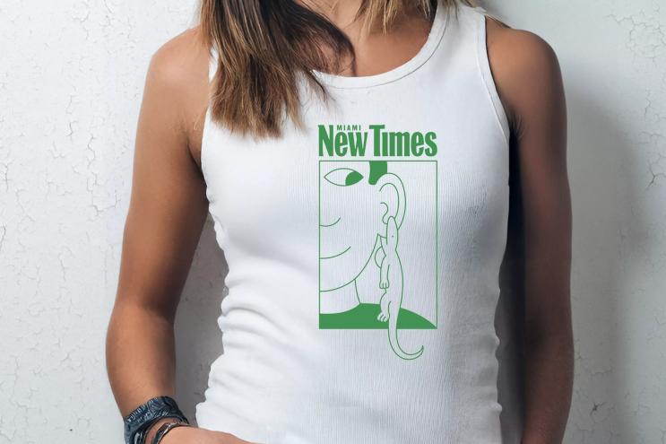A woman wears a white tank top with artwork by Gabriel Alcala. The shirt reads "Miami New Times."