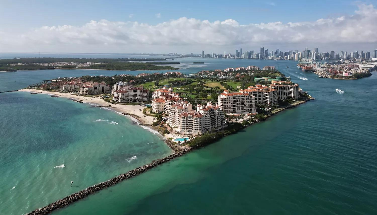 Panorama aerial drone view of Fisher island, with Miami Beach in the background