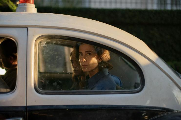 film still from I'm Still Here with Eunice looking through the back window of a vintage car