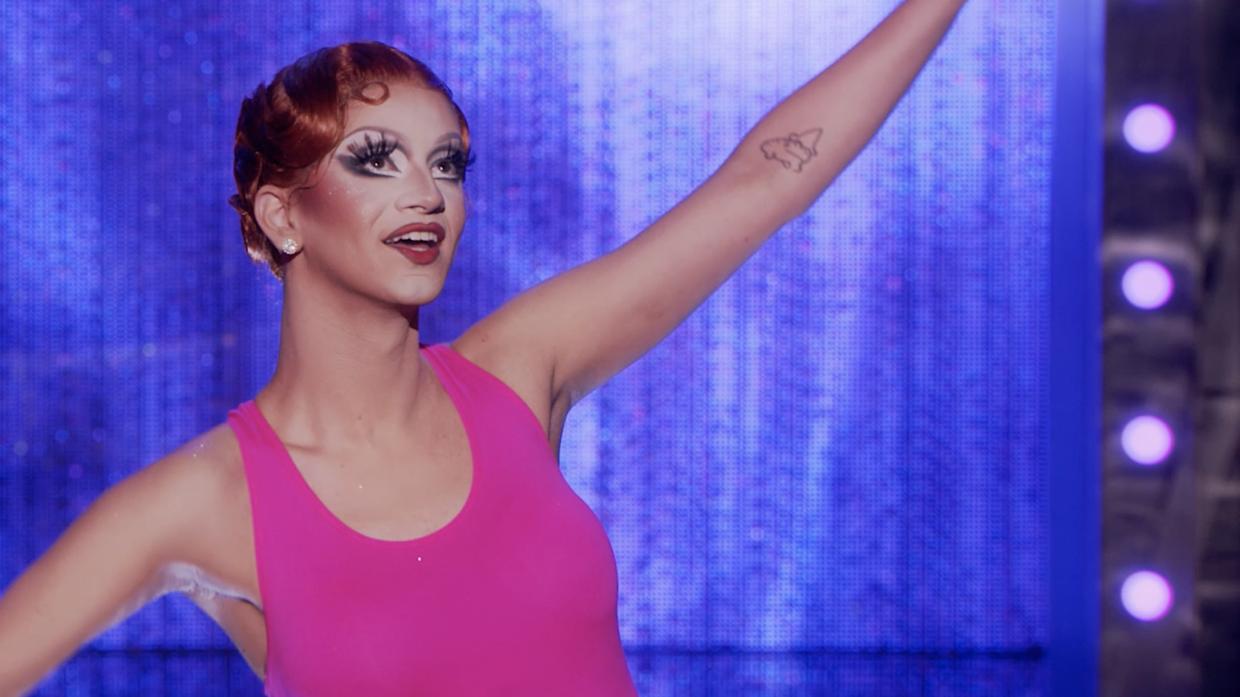 close-up of drag queen Suzie Toot's face and makeup as she performs on stage