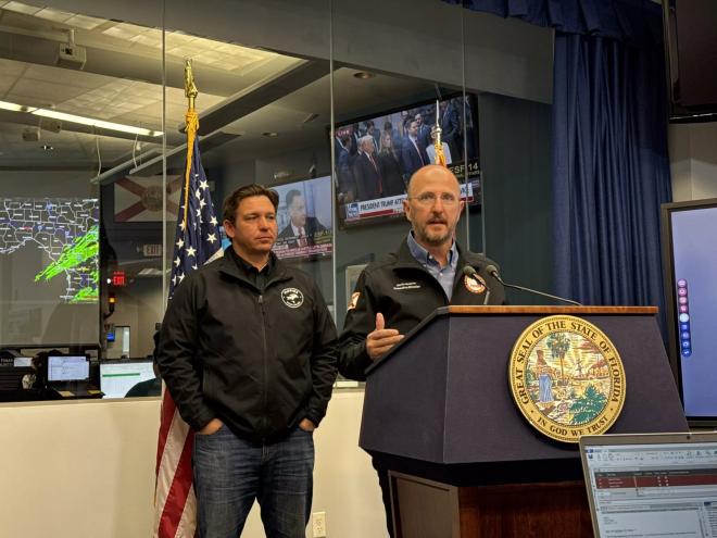two men at a podium
