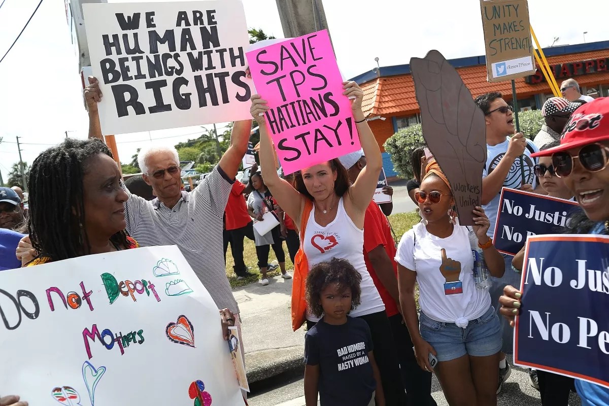 Pro-immigration demonstrators protest in front of a federal office in Miami.
