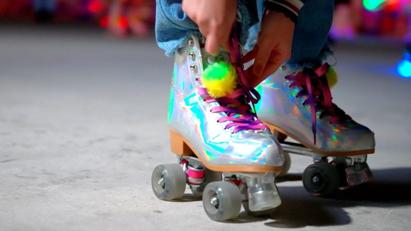 close-up of a pair of iridescent roller skates