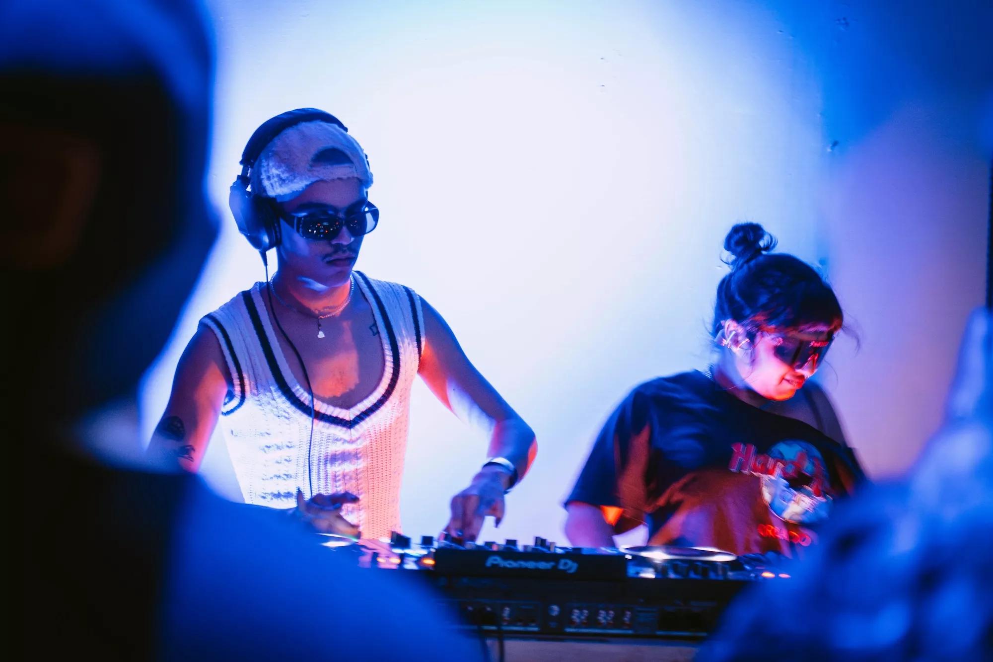 two DJs at decks