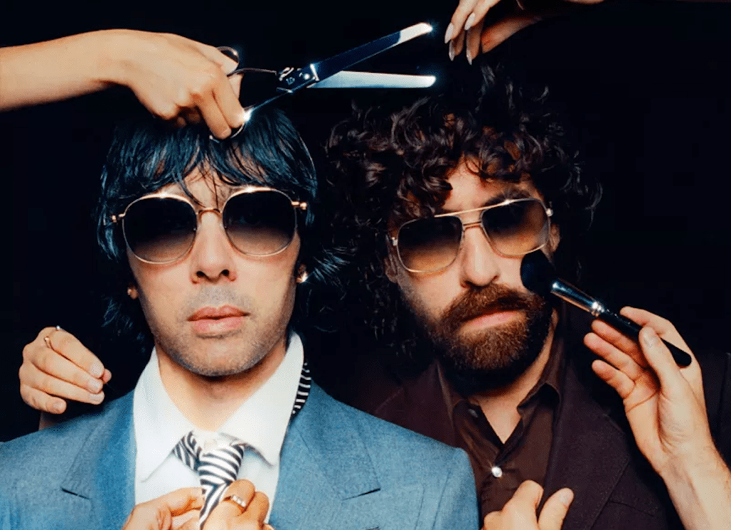 Photo of two men are putting on makeup and getting a haircut