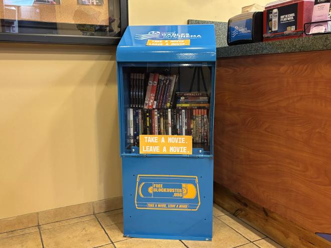 A Free Blockbuster stand inside a movie theater