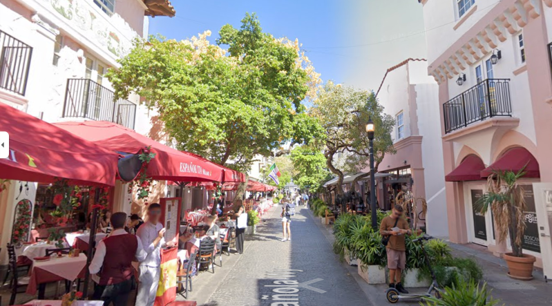 Google Maps screenshot of a pedestrian thoroughfare with outdoor restaurant tables