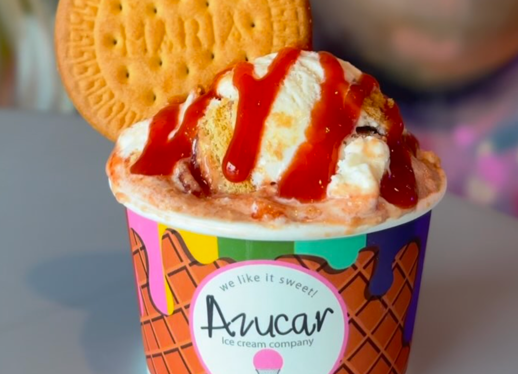 photo of an ice cream cup from Miami's Azucar shop topped with guava sauce and a Maria cookie