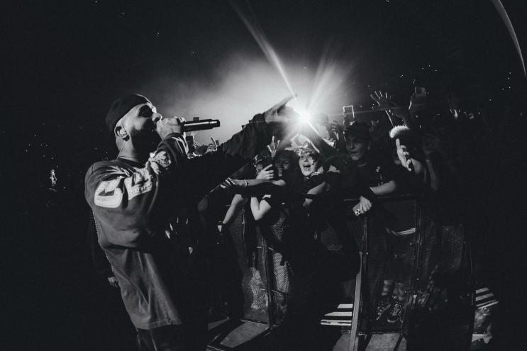 Picture of Eladio Carrion performing in front of fans.